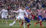 Atlético : Godin préfère voir le Barça triompher